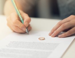 Woman Signing Marriage Documents