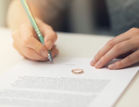 Woman Signing Marriage Documents