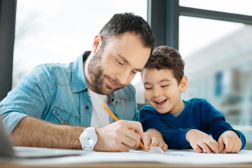 Father and Son Working on Project Together