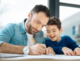 Father and Son Working on Project Together